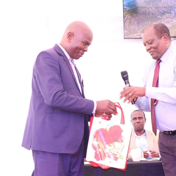 Alfred Mugo Receiving Gift