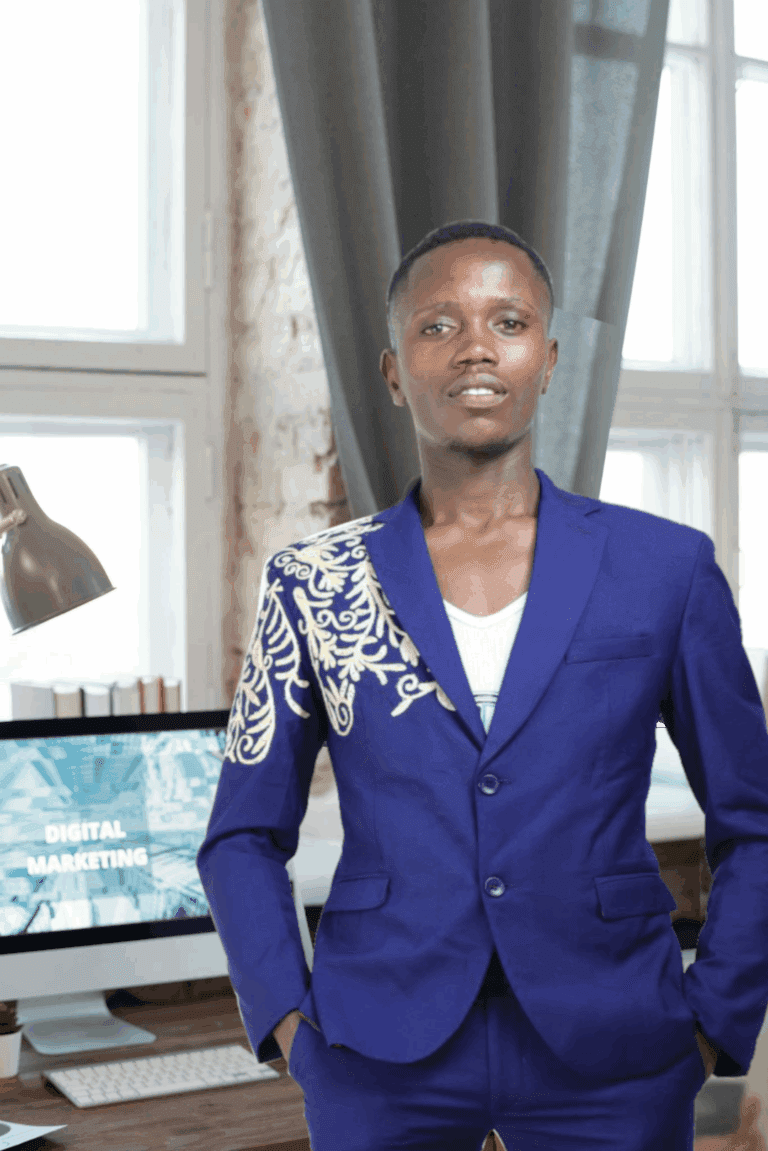 George Mugo standing in an office